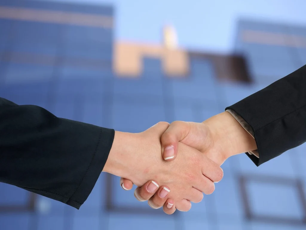 Investor Shaking Hands After A Successful Deal